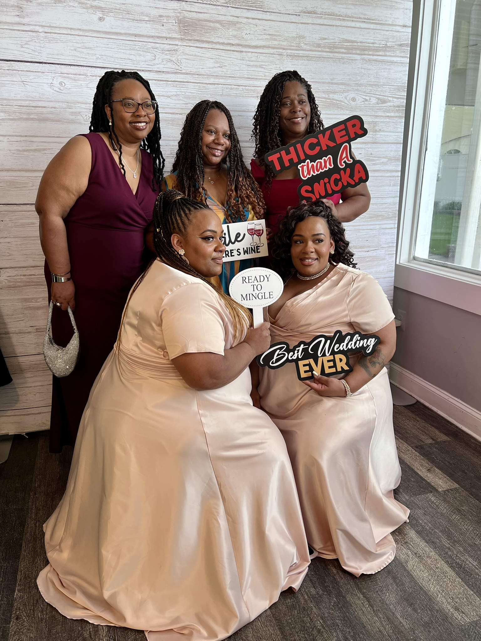 brides maids posing at mirror booth