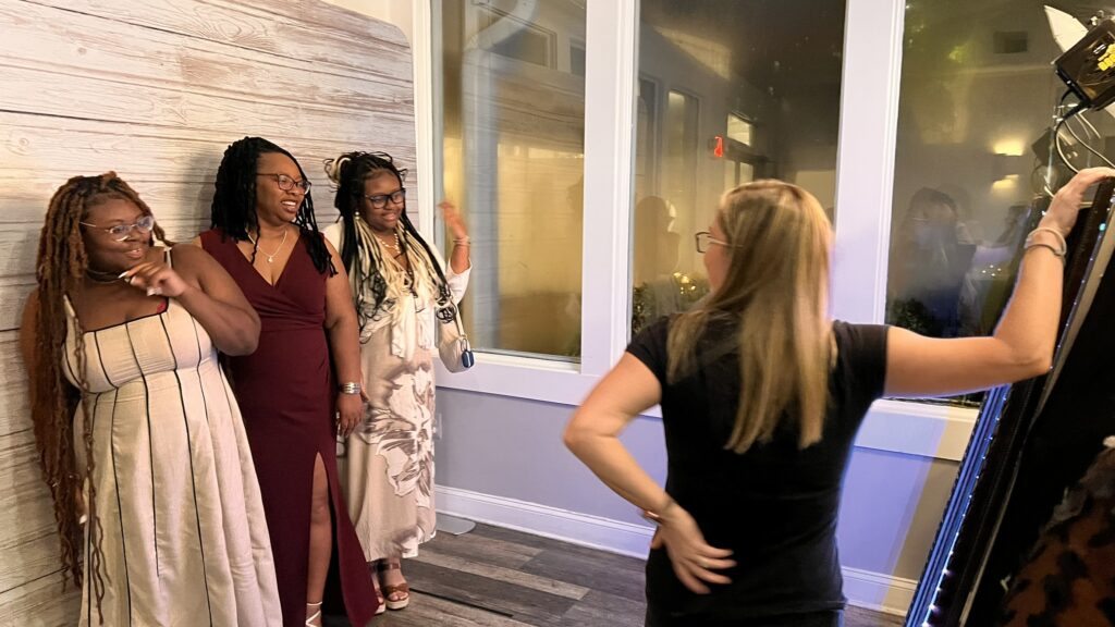 our attendant assisting guests at our mirror booth