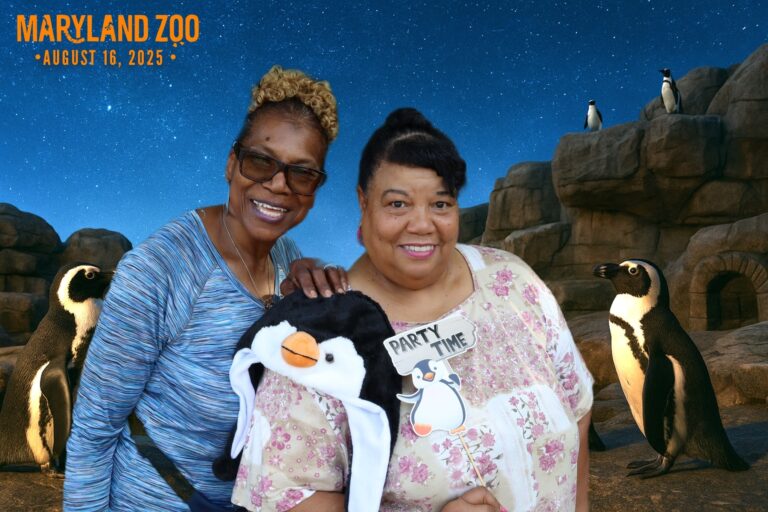 guests posing with digital background at maryland zoo