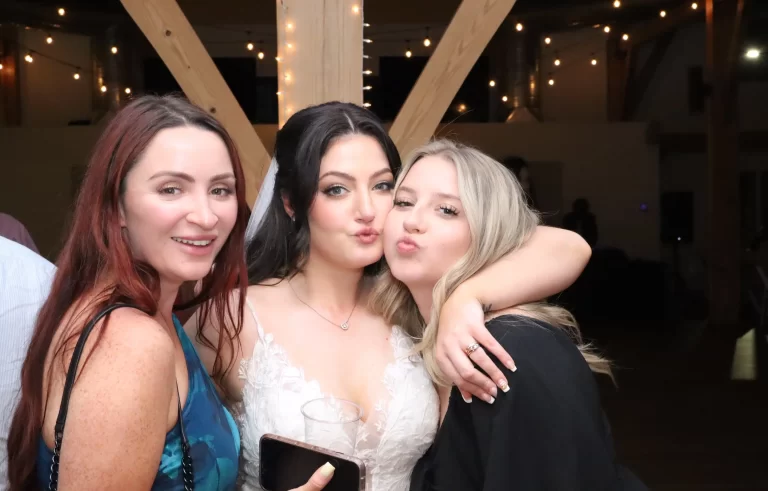 bride posing with friends